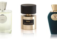 Drei Parfumsflakons unterschiedilcher Größe, Form und Marken stehen nebeneinander.