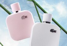 Die NOBILIS GROUP ist neuer Vertriebspartner für die Düfte der Marke LACOSTE Zwei Flakons - einer in zartrosa, einer in weiß - mit dem typischen Krokodil-Logo, schweben scheinbar in der Luft. Im Hintergrund ein grünes Netz vor blauem Himmel.