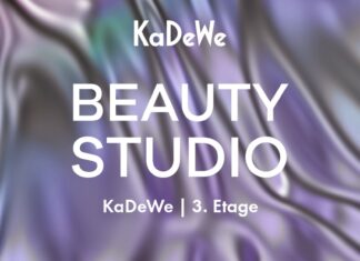 Kuratierte Erlebnis-Destination in Berlin Weißer Schriftzug KaDeWe Beauty Studio vor lia-grün gewirktem Hintergrund.