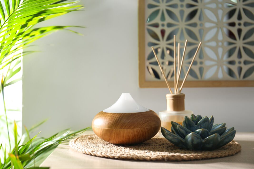 Aroma,Oil,Diffuser,And,Reed,Air,Freshener,On,Table,In